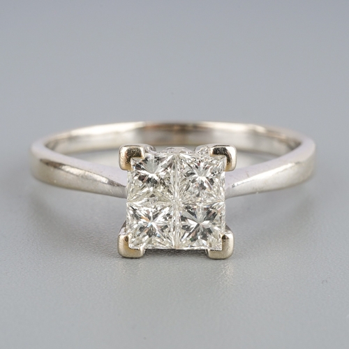 584 - An 18ct gold diamond four stone ring, est 0.60cts, weight 3.77 grams.