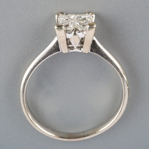 584 - An 18ct gold diamond four stone ring, est 0.60cts, weight 3.77 grams.