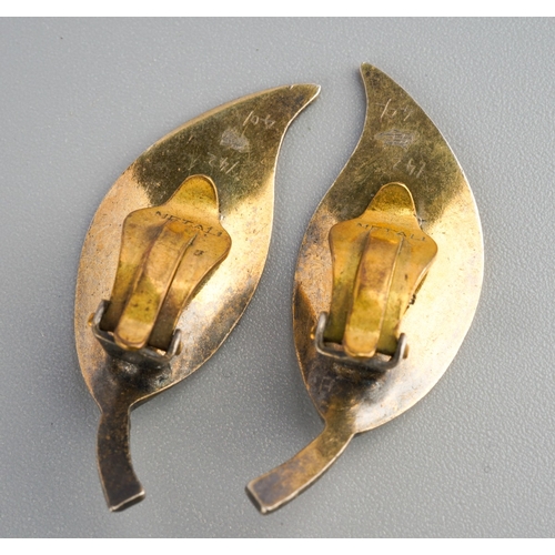 750 - A pair of silver and white enamel leaf form clip on earrings by David Andersen, marked to back