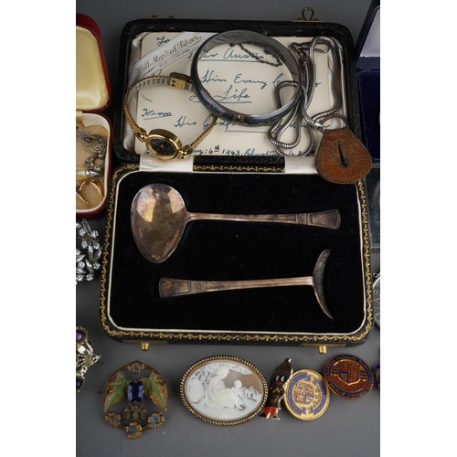 752 - Collection of coins, costume jewellery and silver items to include silver sugar tongs (29g), silver ... 