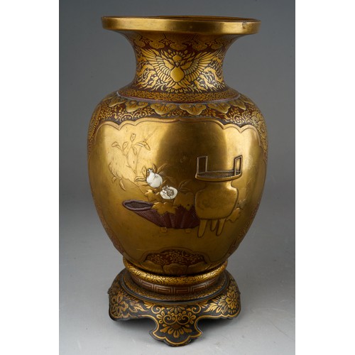 331 - A Japanese Shibayama gilt and brown lacquered papier mache vase, inlaid with  mother of pearl and iv... 