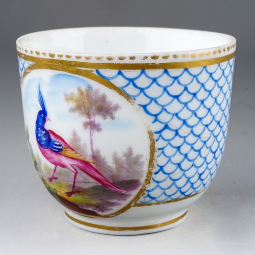 332 - A 19th century Sevres porcelain coffee cup, blue fish scale design with vignette of an exotic bird s... 