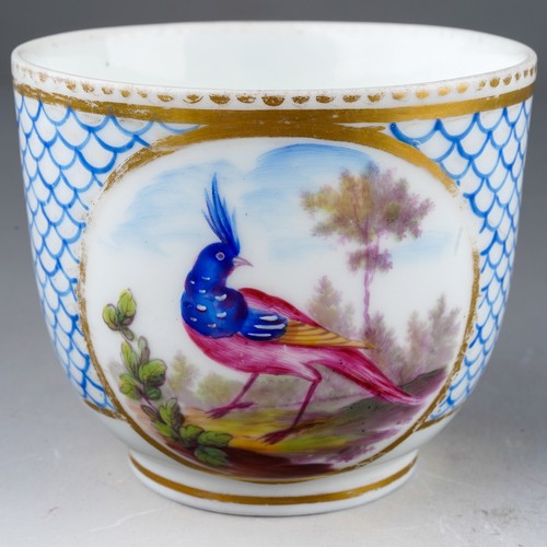 332 - A 19th century Sevres porcelain coffee cup, blue fish scale design with vignette of an exotic bird s... 