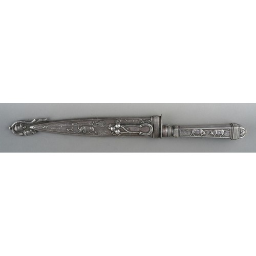 334 - A late 20th century Argentinian Inox white metal Gaucho knife with matching sheath, cast with cattle... 