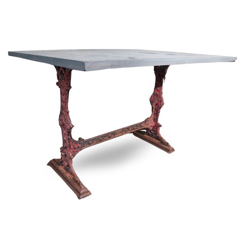 471 - A Victorian cast iron trestle table with rectangular slate top, the base cast with scrolls and raise... 