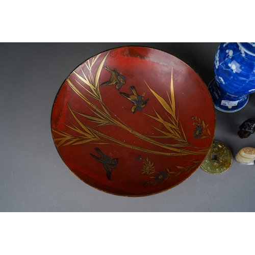 691 - A Japanese gilt and red lacquer bowl decorated with birds, flowers and bamboo, approx 23cm diam (chi... 