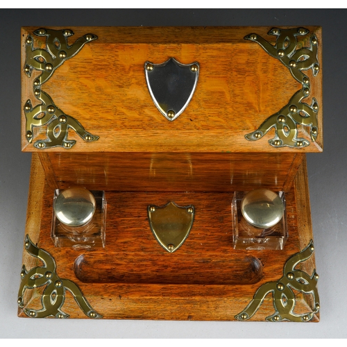 692 - A Victorian style oak brass mounted stationary box, the cover opens to reveal fitted interior, with ... 