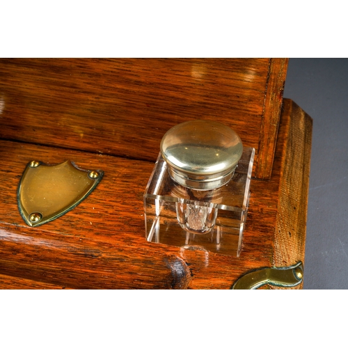692 - A Victorian style oak brass mounted stationary box, the cover opens to reveal fitted interior, with ... 