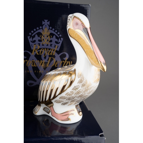 16 - Three Royal Crown Derby Paperweights to include: 
1. White Pelican, gold stopper, limited edition 20... 