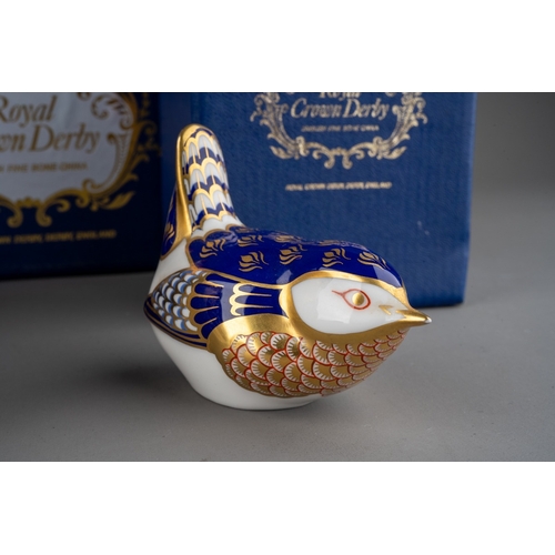 17 - Three Royal Crown Derby Paperweights to include: 
1. Wren, gold stopper, boxed
2. Barn Owl, gold sto... 