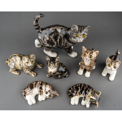 19 - Six Winstanley kittens and a Winstanley Cat, the cat standing, tail broken and reglued at base, heig... 