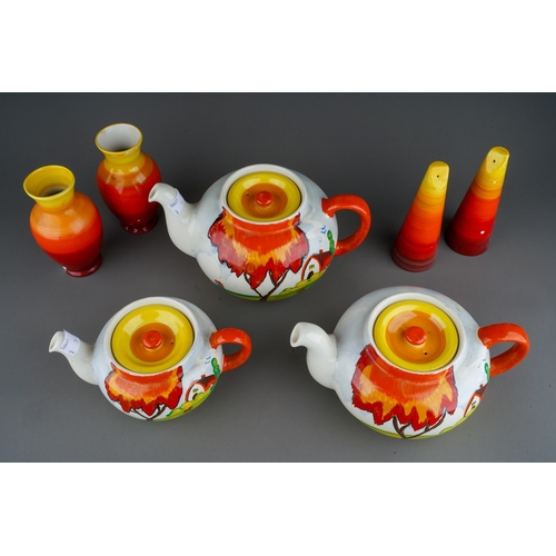 21 - A collection of Emilio James pottery, brightly painted in Clarice Cliff and Shelley style, comprisin... 