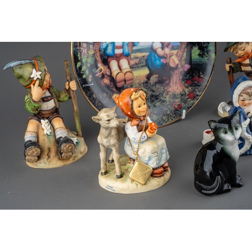 30 - A group of Goebel figures to include: Snow Angel with lamp taperstick holder, 1958; Boy with basket ... 