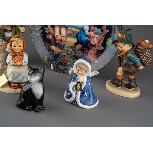 30 - A group of Goebel figures to include: Snow Angel with lamp taperstick holder, 1958; Boy with basket ... 