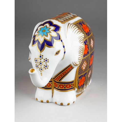 33 - A Royal Crown Derby paperweight in the form of an Imari 1128  small elephant, gold stopper, first qu... 