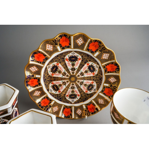 36 - Four pieces of Royal Crown Derby porcelain in the 1128 Imari pattern, comprising a wavy rimmed plate... 