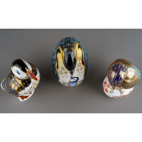 38 - Three Royal Crown Derby paperweights, comprising a Kingfisher, a puffin and a Penguin and chick, all... 