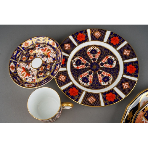 46 - A Derby porcelain coffee can and two matched saucers decorated flowers and gilt scrolls, circa 1840s... 