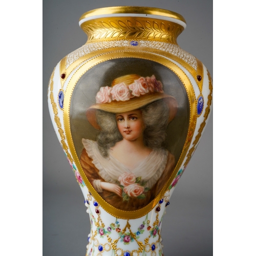 64 - A pair of early 20th Century Vienna porcelain vases, each profusely decorated with gilt and painted ... 