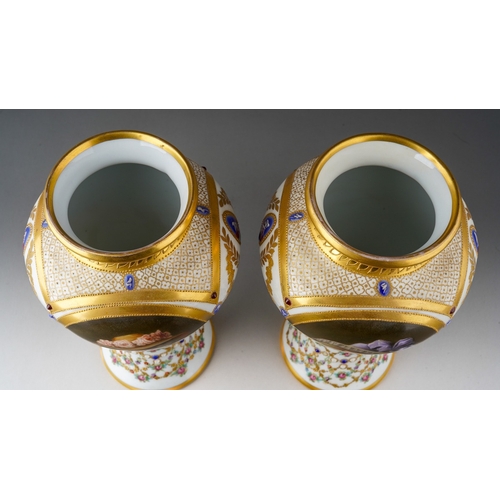 64 - A pair of early 20th Century Vienna porcelain vases, each profusely decorated with gilt and painted ... 