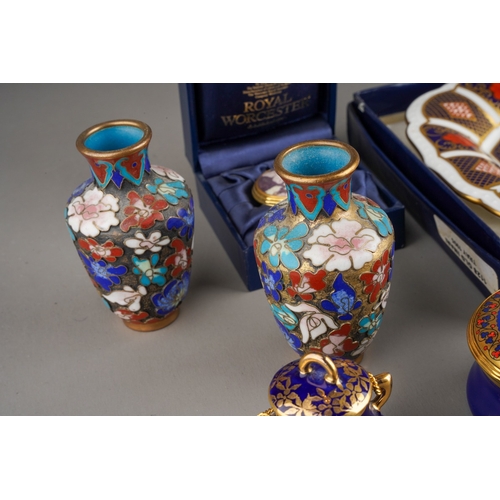 67 - A collection of boxed ceramic boxes and covers to include: Royal Worcester Millenium and small Candy... 