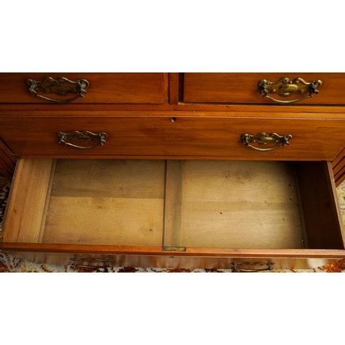 387 - An Edwardian walnut dressing table, the back with central swing mirror flanked by fret carved and mi... 