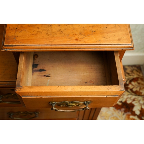 387 - An Edwardian walnut dressing table, the back with central swing mirror flanked by fret carved and mi... 