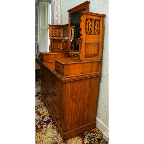 387 - An Edwardian walnut dressing table, the back with central swing mirror flanked by fret carved and mi... 