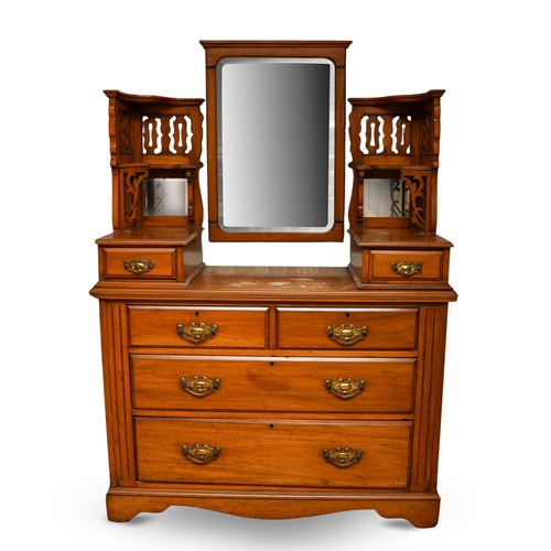 387 - An Edwardian walnut dressing table, the back with central swing mirror flanked by fret carved and mi... 