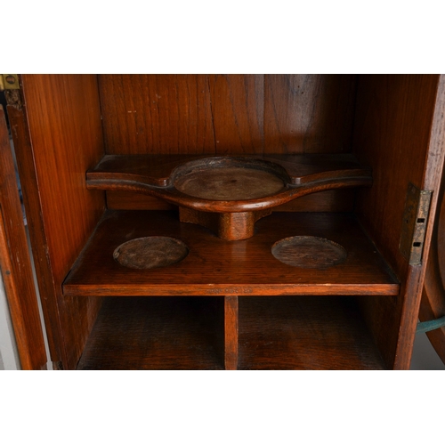 394 - An early 20th Century carved mahogany novelty coat wall rack in the form of a horse shoe with eight ... 