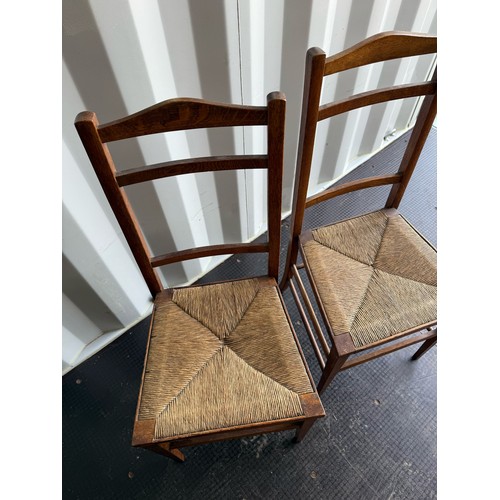 399 - Two rush seat Oak Chairs