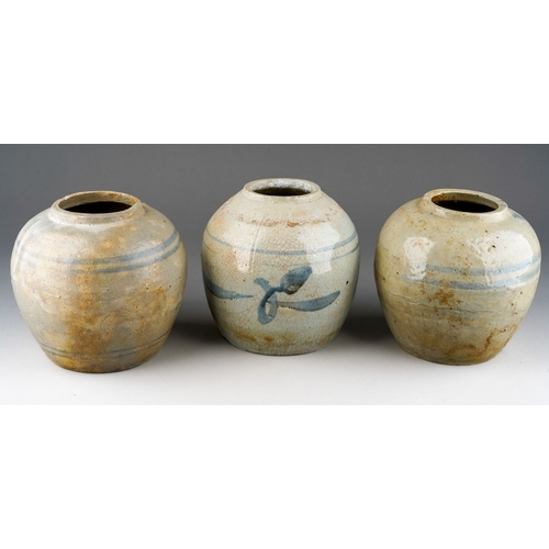 1009 - Three Provincial Chinese stoneware ginger jars., one with leaf decoration, one with hairline fractur... 