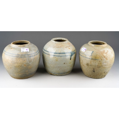 1009 - Three Provincial Chinese stoneware ginger jars., one with leaf decoration, one with hairline fractur... 