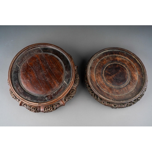 1011 - Two Chinese carved hardwood bowl stands, some splits, approx 27cm and 23cm at widest points [2]