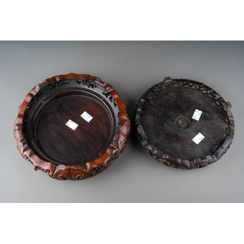 1011 - Two Chinese carved hardwood bowl stands, some splits, approx 27cm and 23cm at widest points [2]