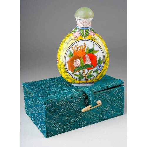 1014 - A second half 20th century Chinese opaque glass snuff bottle, decorated with fruit and scrolls, mark... 