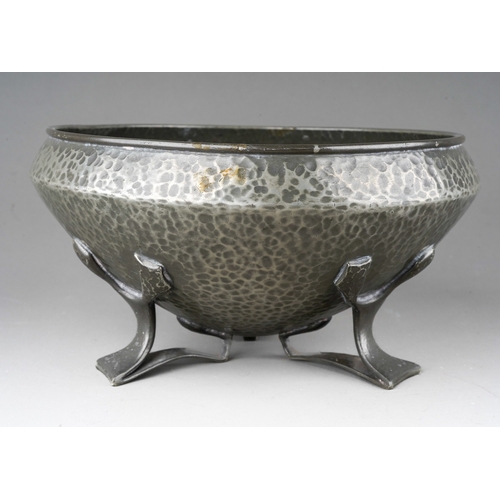 1029 - A Liberty & Co English Pewter (Tudric) hammered bowl on three supports, stamped 01128, the aperture ... 