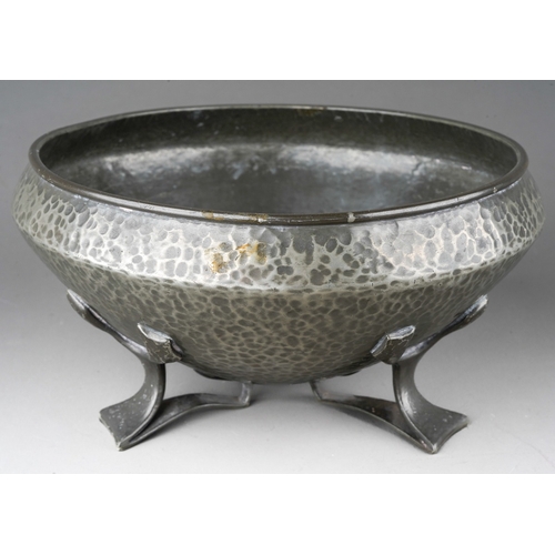 1029 - A Liberty & Co English Pewter (Tudric) hammered bowl on three supports, stamped 01128, the aperture ... 