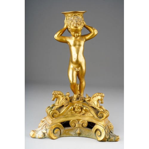 1030 - A 18th Century style French gilt metal candlestick, modelled as a putto holding scone aloft on tripo... 