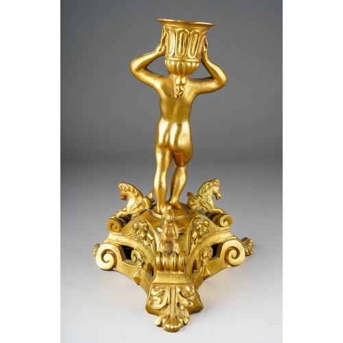 1030 - A 18th Century style French gilt metal candlestick, modelled as a putto holding scone aloft on tripo... 