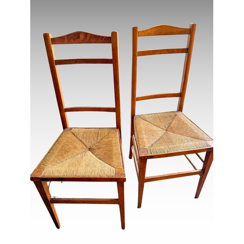 399 - Two rush seat Oak Chairs