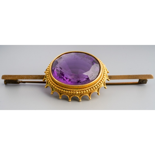 679 - An early 20th century amethyst bar brooch, unmarked, approx length 75mms, gross weight 19.16 grams.