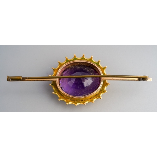 679 - An early 20th century amethyst bar brooch, unmarked, approx length 75mms, gross weight 19.16 grams.