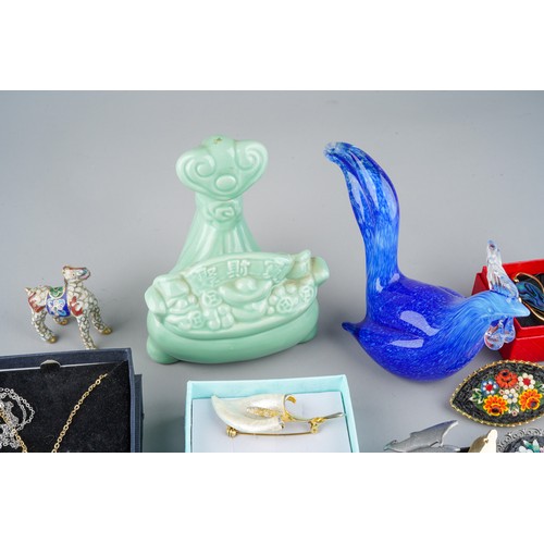 675 - Collection of costume jewellery to include brooches and 4 glass panels together with a blue glass Co... 