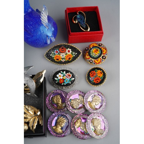 675 - Collection of costume jewellery to include brooches and 4 glass panels together with a blue glass Co... 