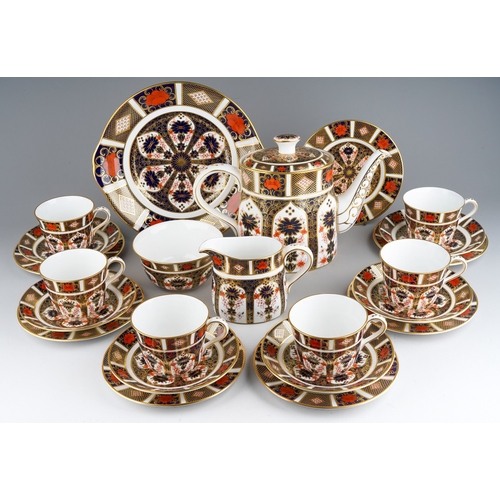 A Royal Crown Derby Imari pattern 1128 tea set, first quality, including cake plate, tea pot, 6 cups, 6 saucers, 7 side plates and a cake plate