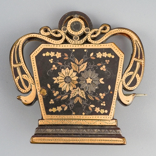 593 - An early 19th century tortoiseshell pique brooch. Approx length 45mm, gross weight 8.35 grams.