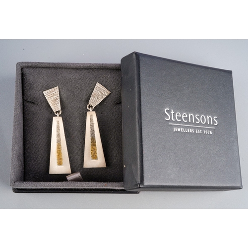 841 - A pair of yellow and white metal earrings. Stamped 925, fixed posts for pierced ears, with Steenson ... 