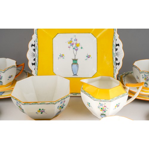 98 - A Shelley  Art Deco tea set in yellow, decorated with urns and flowers, RD number 723404 pattern 116... 