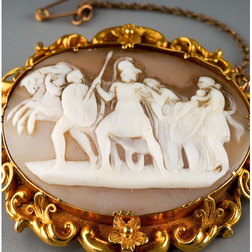 31 - A late 19th century yellow metal mounted cameo brooch, the oval cameo with Classical chariot scene, ... 